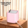 A pink silicone protective cover is shown charging a Toniebox 2 without removing the case.
