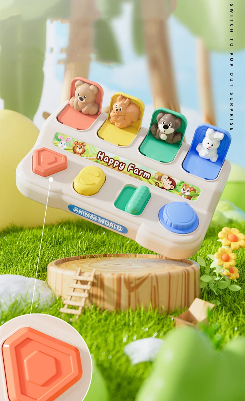 A white sensory toy featuring animal figures in colored slots, set in a green outdoor environment.