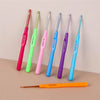 A set of seven aluminum alloy crochet hooks in various colors and sizes displayed on a neutral background.