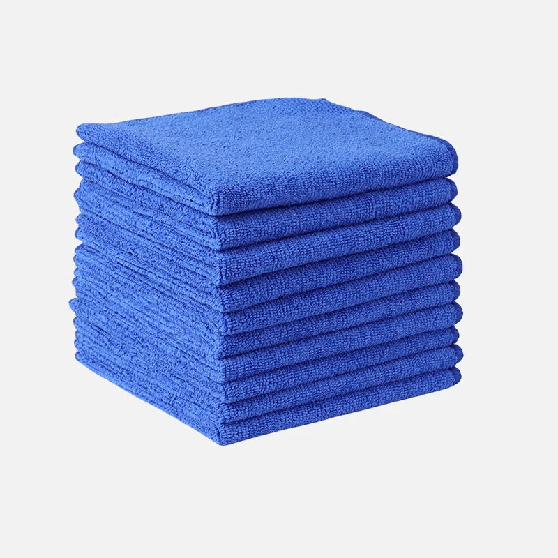 A stack of bright blue microfiber cleaning towels.