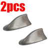Two gray shark fin car antennas for FM/AM signal enhancement