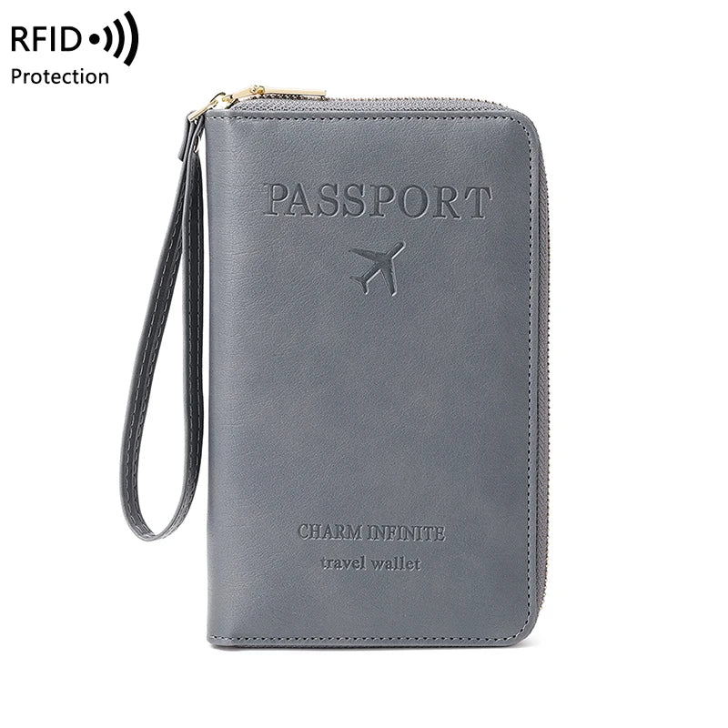 A gray passport RFID-blocking travel wallet with a gold chain strap and a stylized airplane emblem.