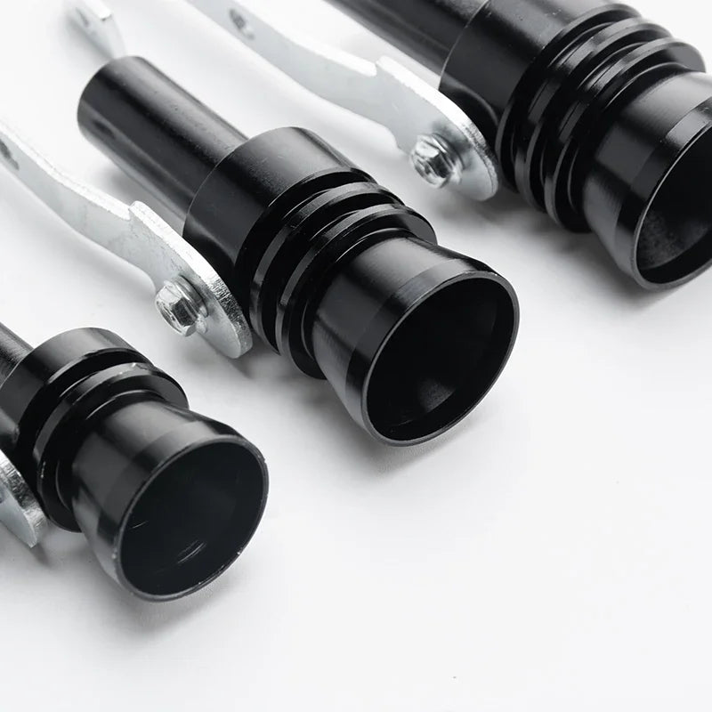 A close-up view of a black exhaust turbine whistle fitting, showing the metal end and the black cylindrical body.