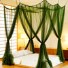 Elegant mosquito net bed canopy draped over a bed in a bright room.