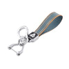 Silver key fob cover with a dark blue and orange striped protective TPU sleeve.