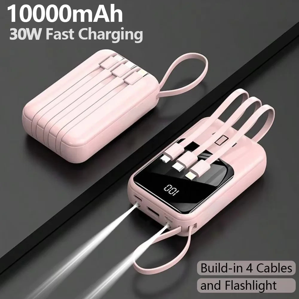 Pink portable power bank with built-in cables and flashlight shown on a dark surface.