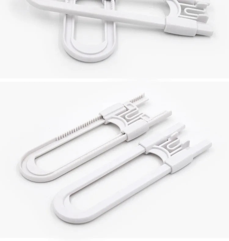 A white adjustable U-shaped cabinet lock with a metal key, shown in a close-up view.