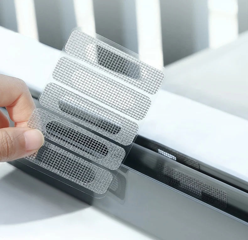 A hand applies a clear, self-adhesive window screen repair patch onto a window frame.