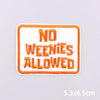 An embroidered patch with the text NO WEENIES ALLOWED in orange thread on a white background.