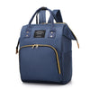Navy insulated canvas mummy diaper bag with a hanging hook and zippered pocket