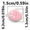 A pink, oval-shaped ceramic fish bead shown with dimension lines indicating its size.