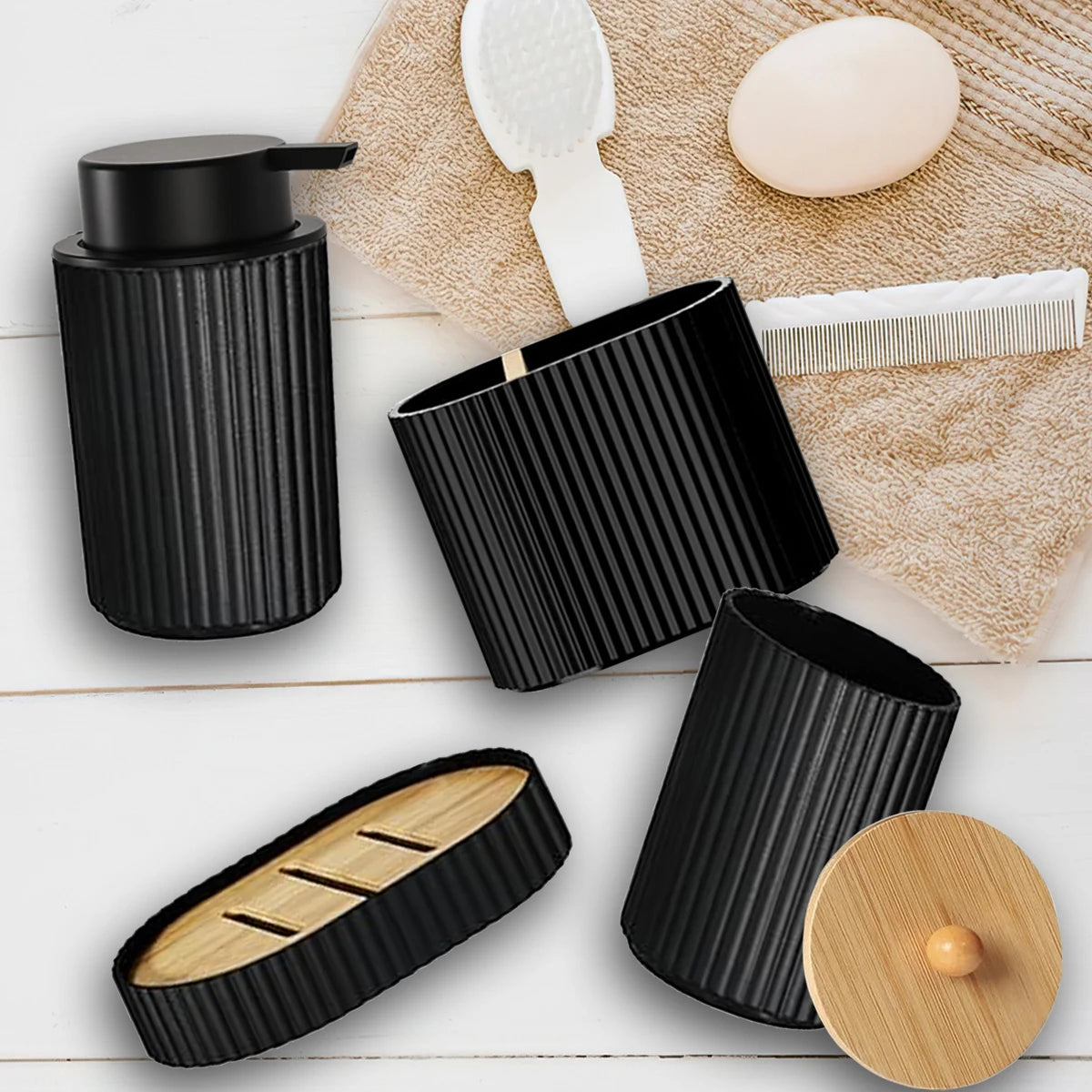 Matte black bathroom accessories set including a soap dispenser and holder on a wooden surface.