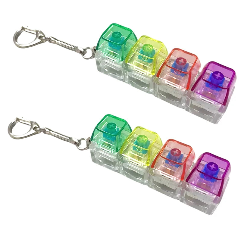 A set of colorful LED light-up keyboard fidget toys attached to a silver keychain.