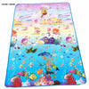 A colorful play mat featuring farm animal designs for baby