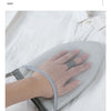 A hand wearing a mesh ironing glove is shown resting on a white cloth, demonstrating the product for ironing clothes.