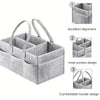 Gray canvas diaper storage organizer with multiple compartments and handles for easy transport