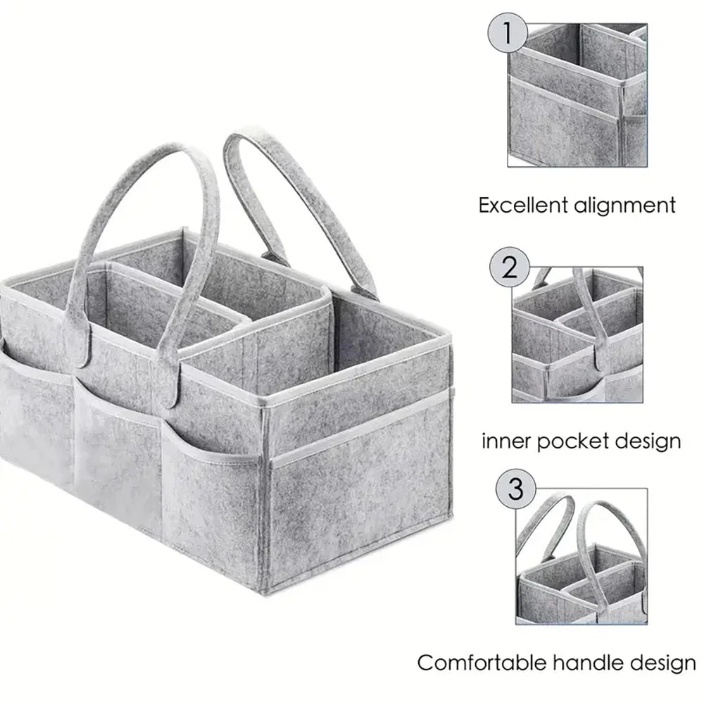 Gray canvas diaper storage organizer with multiple compartments and handles for easy transport