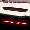 A black brake light sticker is shown mounted on a white car surface, with a red glow effect below.