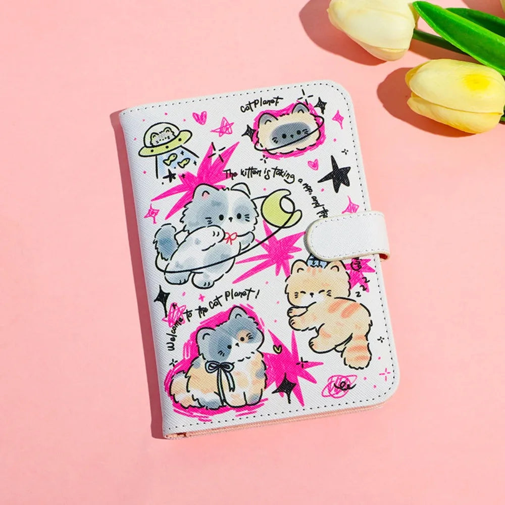 A pink and white cartoon cat-themed leather passport holder featuring cute illustrations of cats and stars.