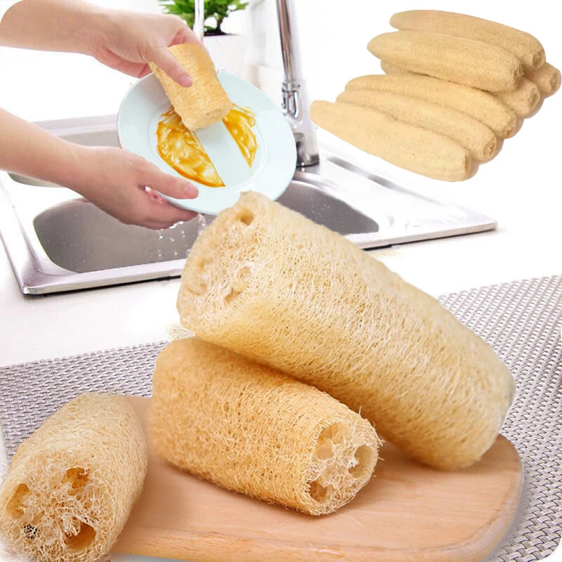 A stack of natural loofah body scrubbers with hanging rope shown next to a cutting board.