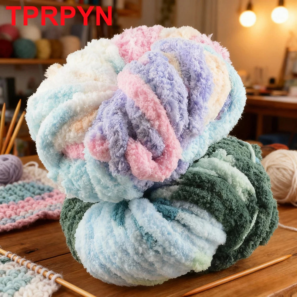 A ball of multicolored fluffy acrylic yarn in shades of pink, purple, blue, and green resting on a wooden surface.