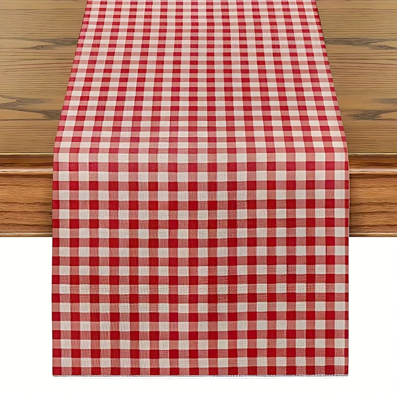 A red and white gingham table runner placed on a wooden table.