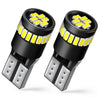 A pair of black LED light bulbs with yellow illumination and metal contacts are shown.