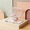 A clear acrylic tablet stand with pink accents is shown resting on a light-colored box.
