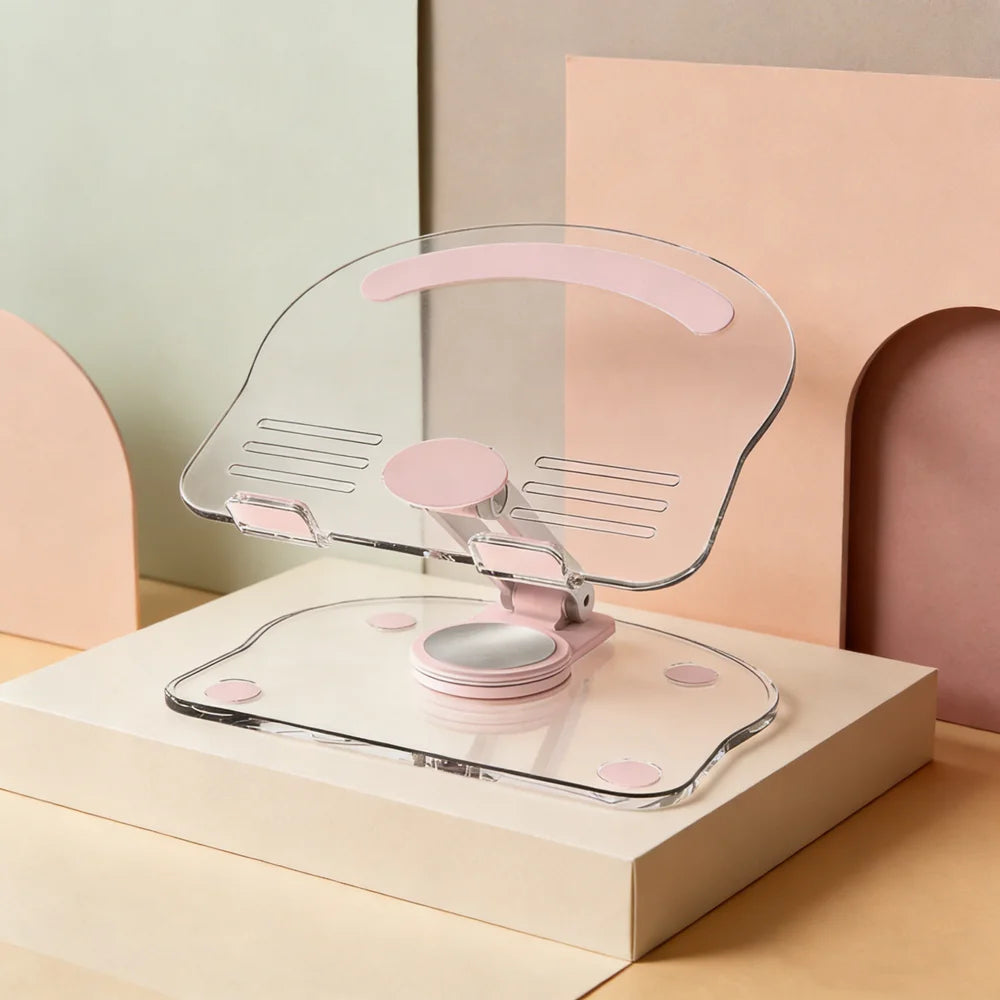 A clear acrylic tablet stand with pink accents is shown resting on a light-colored box.