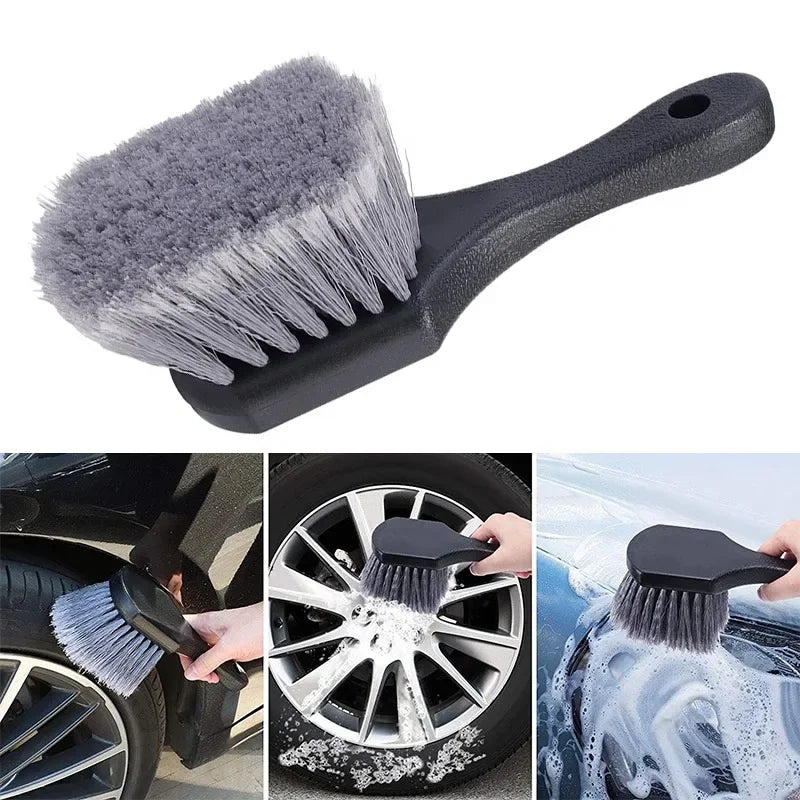 A black compact brush set with a silicone head is shown cleaning a car wheel and tire.
