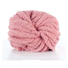 A ball of pink chunky acrylic yarn used for knitting and crochet projects.