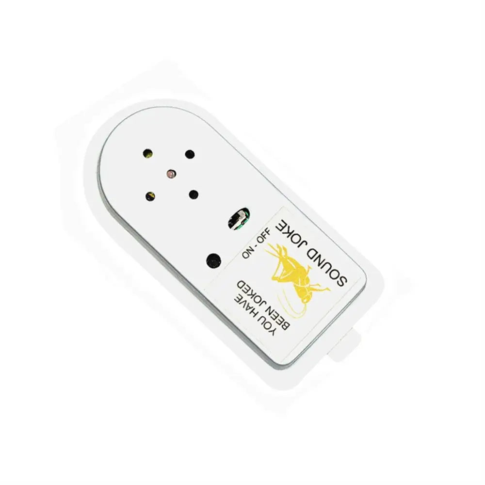 A white electronic device with multiple small holes and a yellow graphic labeled SOUND JOKE ON OFF.
