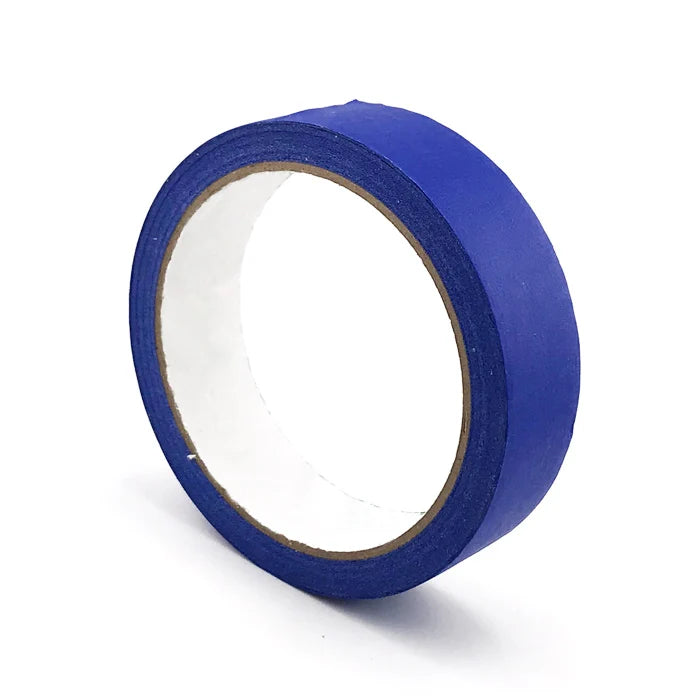 A roll of blue masking tape with a white inner core shown from the side.