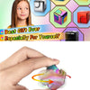 A hand holds a colorful, iridescent metal fidget cube spinner for stress relief.