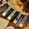 Vintage metal bookmarks featuring artistic hollow designs in various shades of blue and purple with silk tassels.