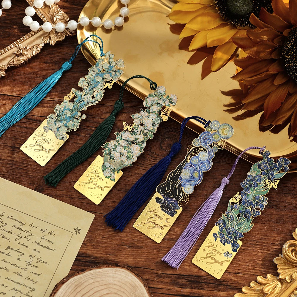 Vintage metal bookmarks featuring artistic hollow designs in various shades of blue and purple with silk tassels.