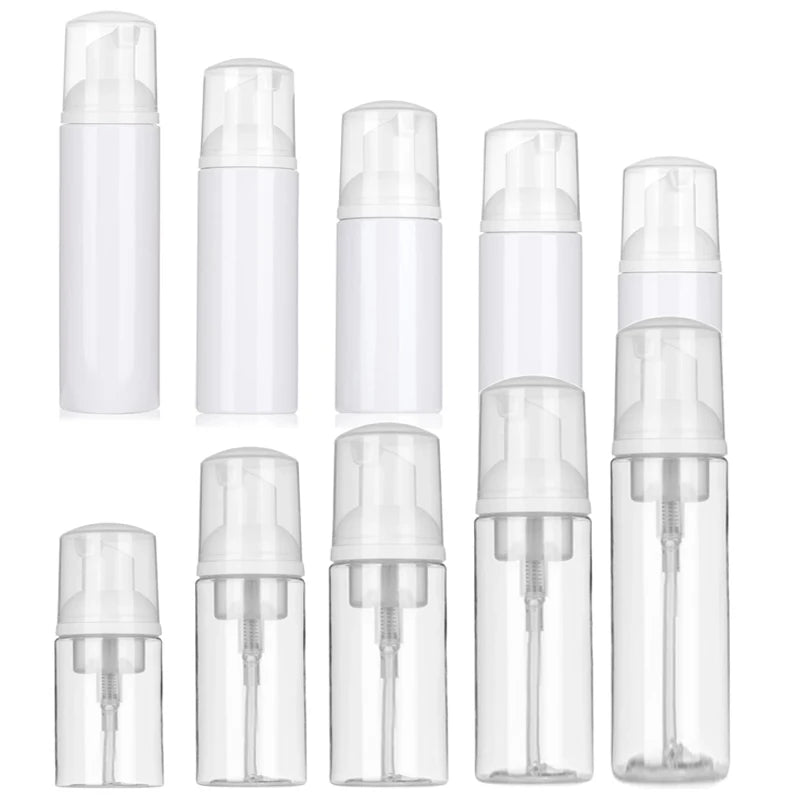 A multi-pack of clear plastic refillable foaming soap dispenser bottles.