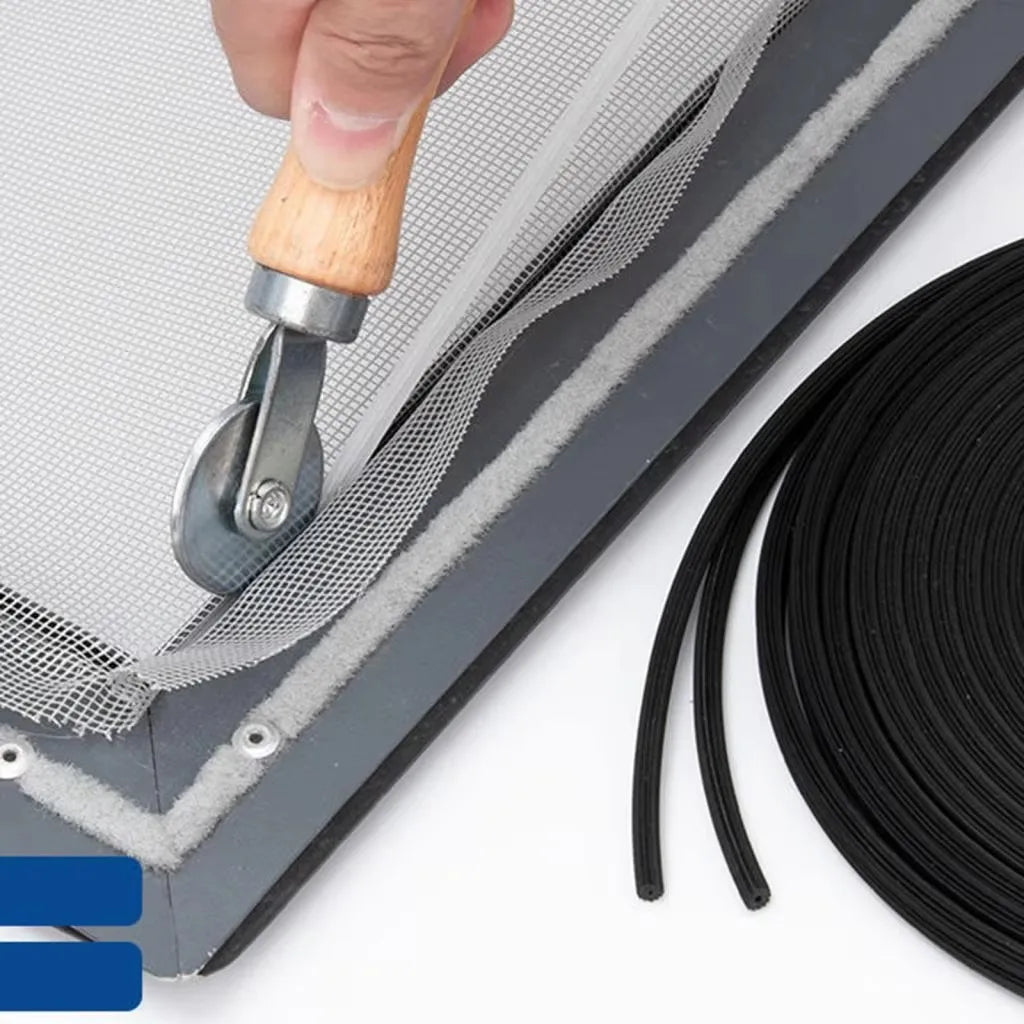 A hand is using a rolling tool to install an insect screen mesh kit on a window frame.