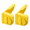 A pair of yellow masonry line corner clips with anti-slip locks shown from above.