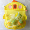 Yellow cartoon duck bath toy storage mesh bag with suction cup filled with various bath toys