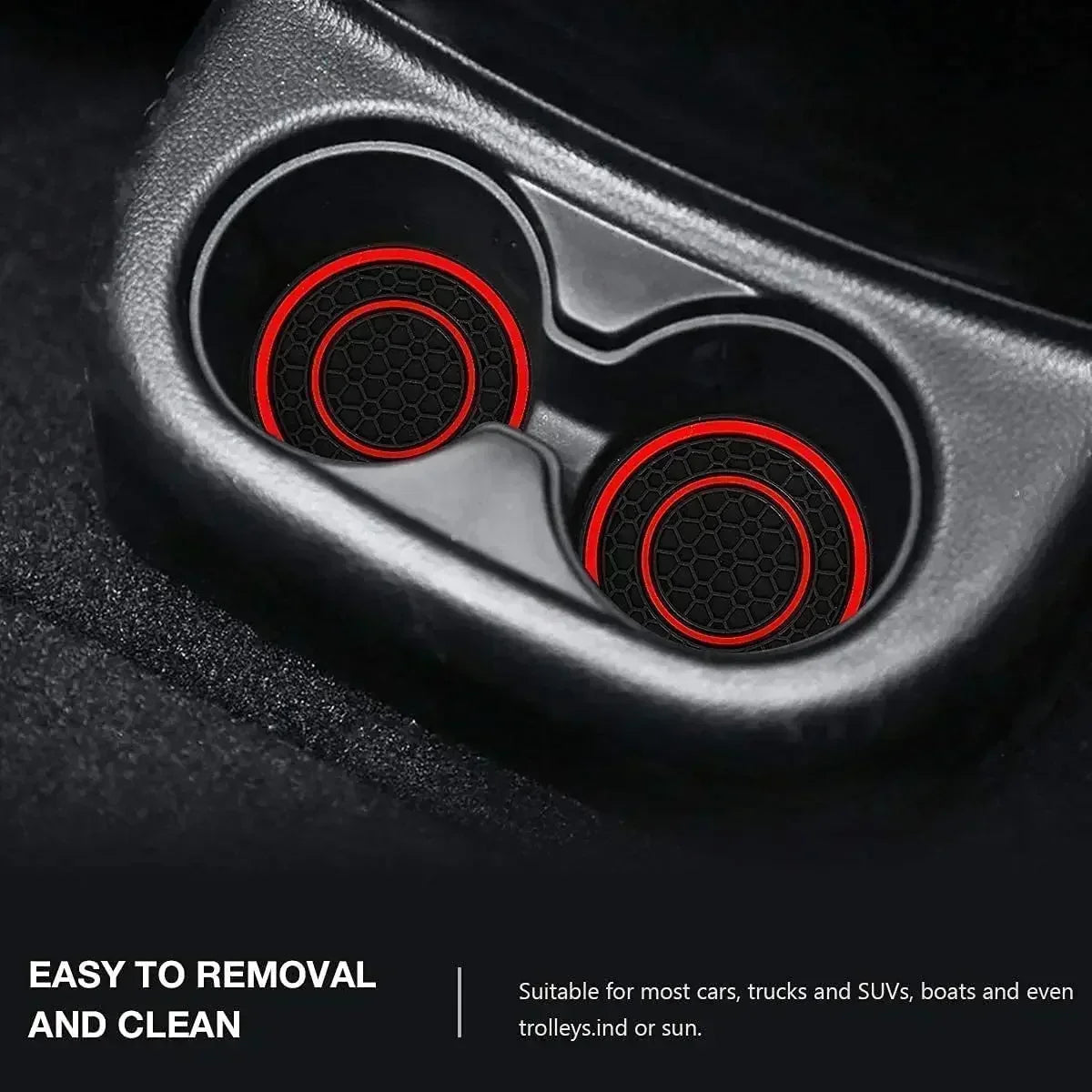 Close-up view of two black silicone coasters with red accents inside a car cup holder