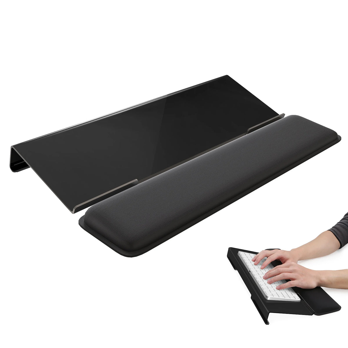 Black ergonomic acrylic keyboard stand with a memory foam wrist rest shown next to a hand typing on the keyboard.