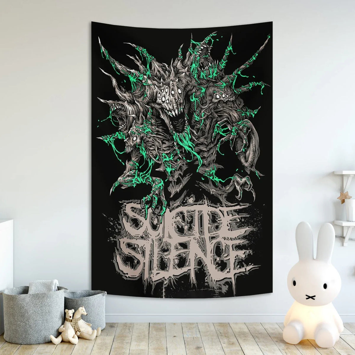 A black tapestry featuring a dark, monstrous design with green accents and the text SUICIDE SILENCE in a distressed font.