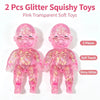Two pink transparent glitter squishy toys, soft silicone fidget toys for stress relief.