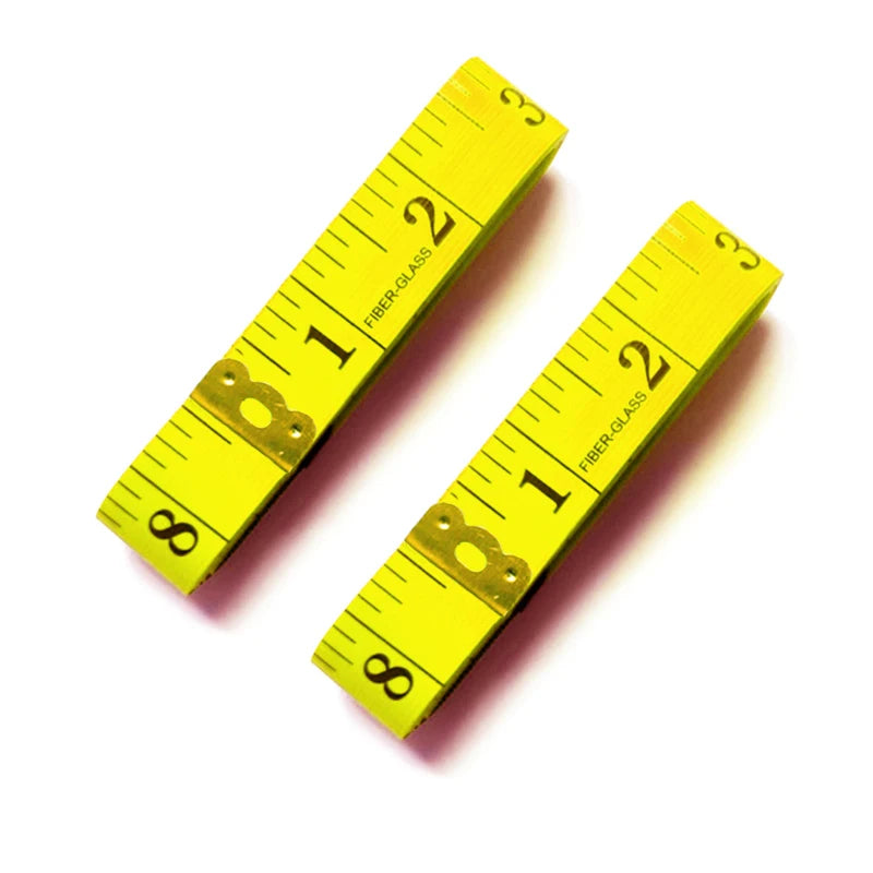 A yellow fiberglass tape measure showing markings up to 3 inches.
