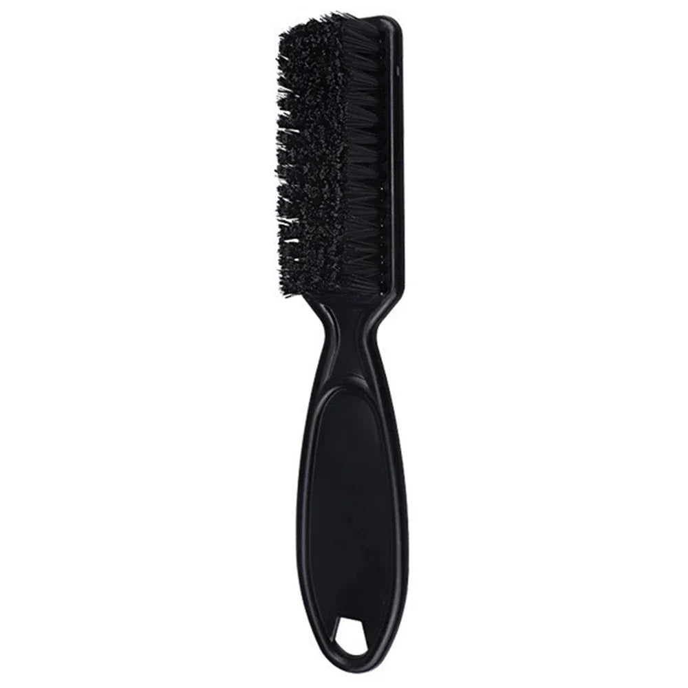 A black grooming brush with a flexible handle for beard and hair styling.