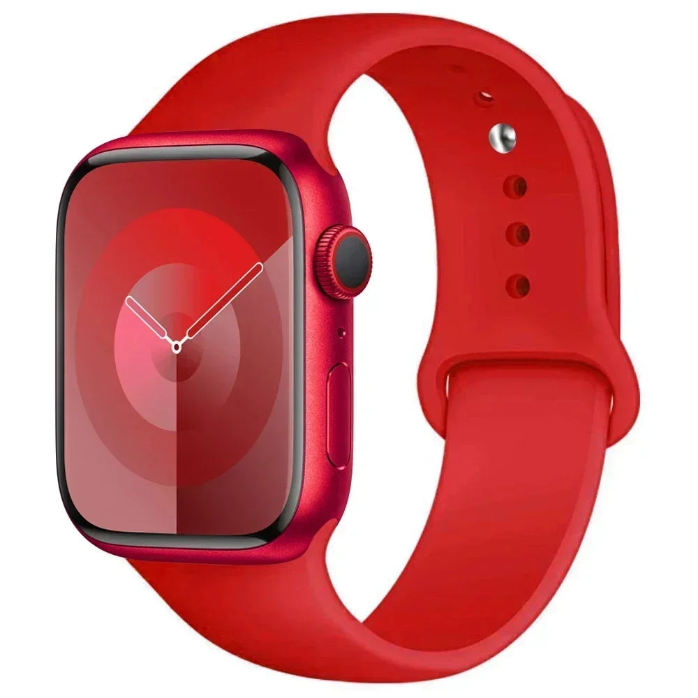 A red silicone sport band for an Apple Watch shown on a white background.