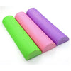 Three half-round EVA foam rollers in lime green, pink, and purple arranged diagonally.