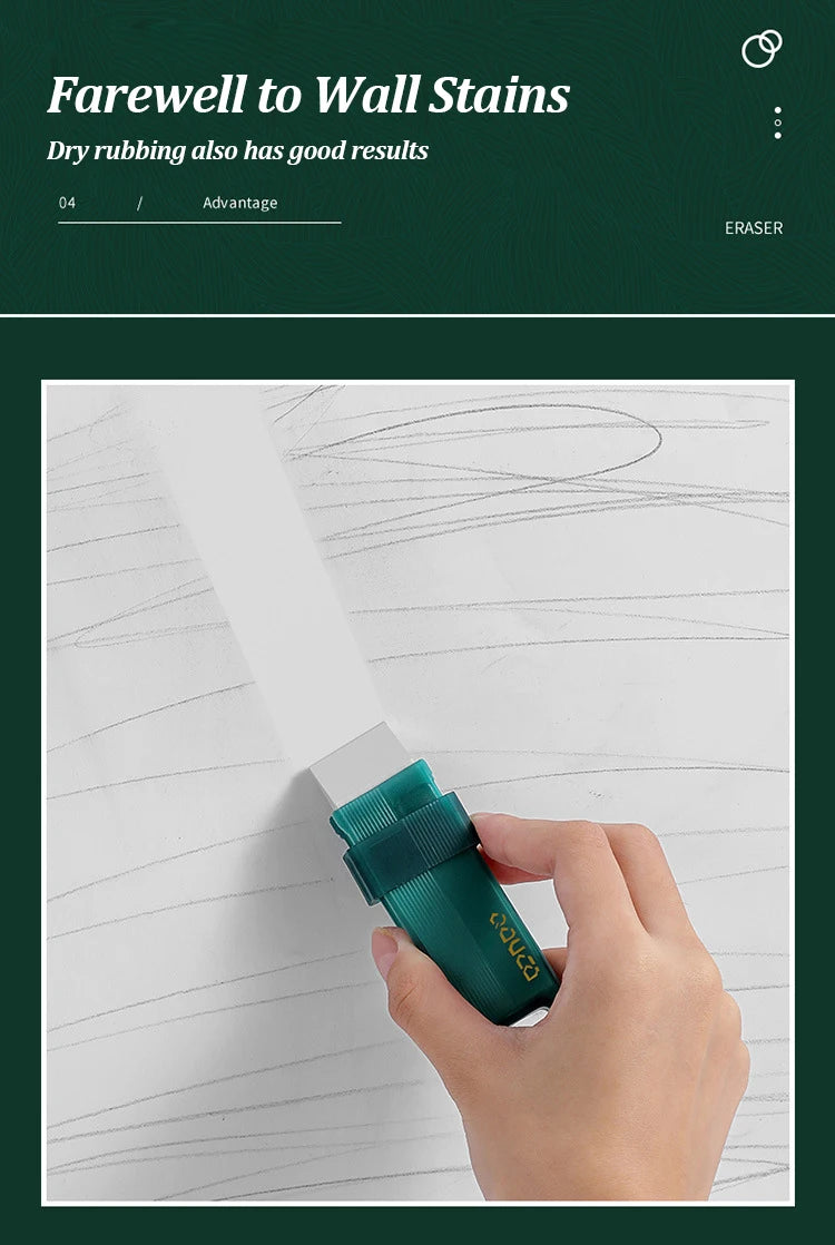 A hand is using a green eraser to remove wall stains from a white surface.