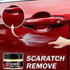 A hand is applying a red repair paste to a red car door to remove scratches.